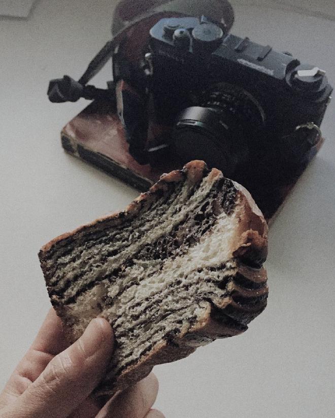 Image of a Voigtlander Bessa T Rangefinder Camera with a slice of chocolate-marbled bread